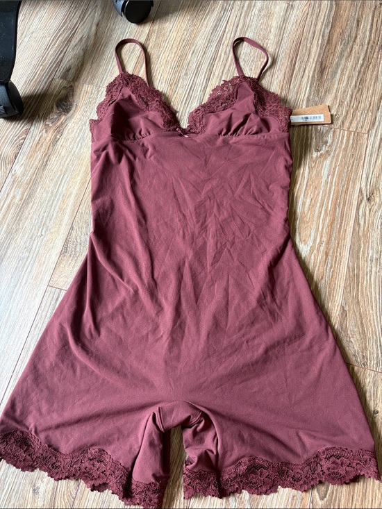 SKIMS Pants - Skims fits everybody lace triangle onesie in Oxblood